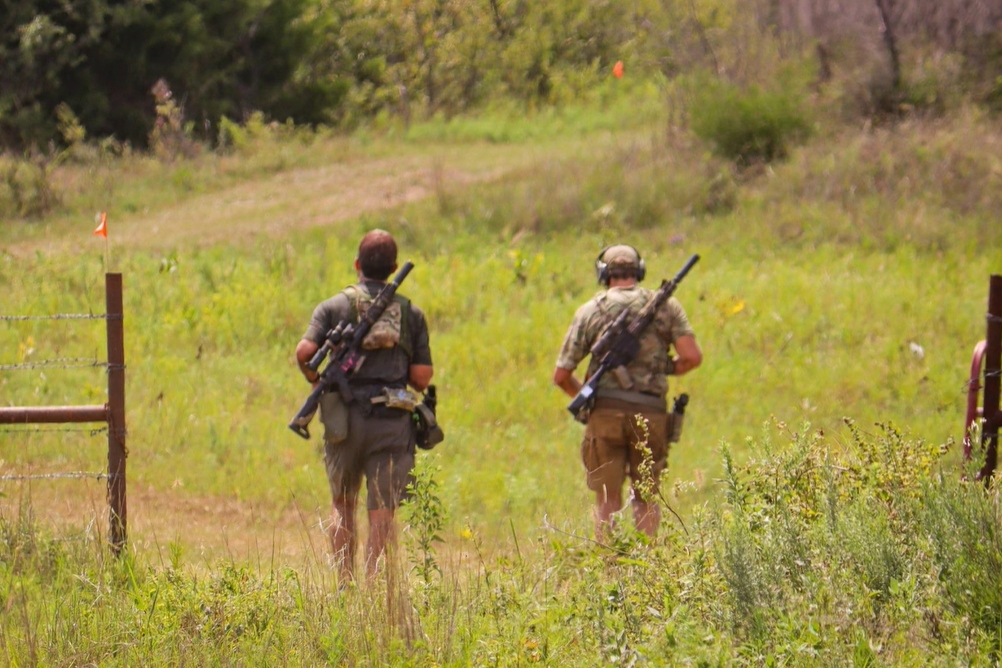 Two-man team moving through the course at The Burial Mound