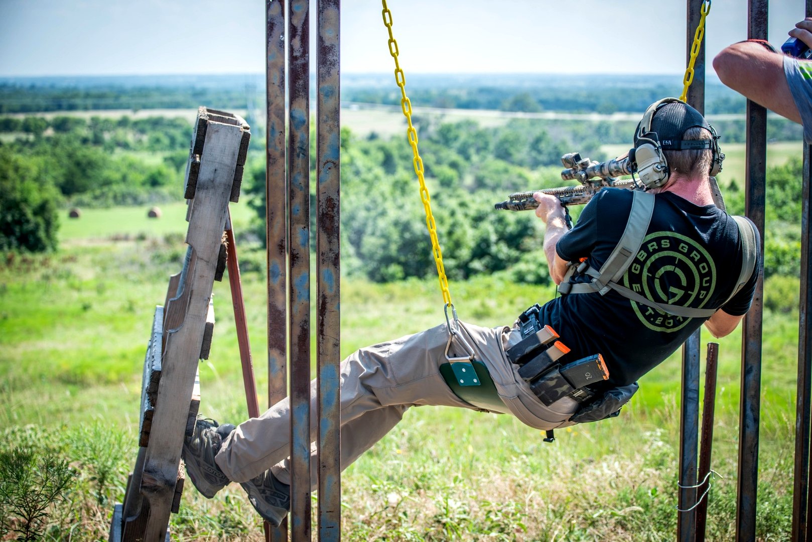 Competitor on swing obstacle